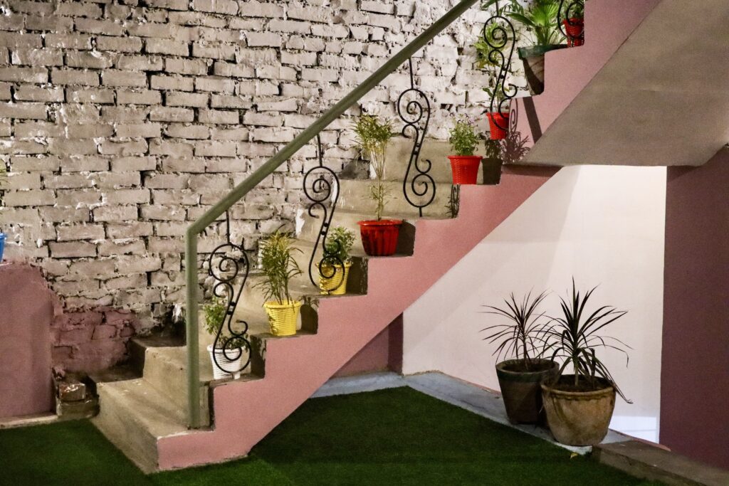 Bed in dorm room at Mosaic Hostel Varanasi Rooftop view at Mosaic Hostel Varanasi Female dorm beds Mosaic Hostel Lobby of Mosaic Hostel Varanasi Wi-Fi zone Mosaic Hostel