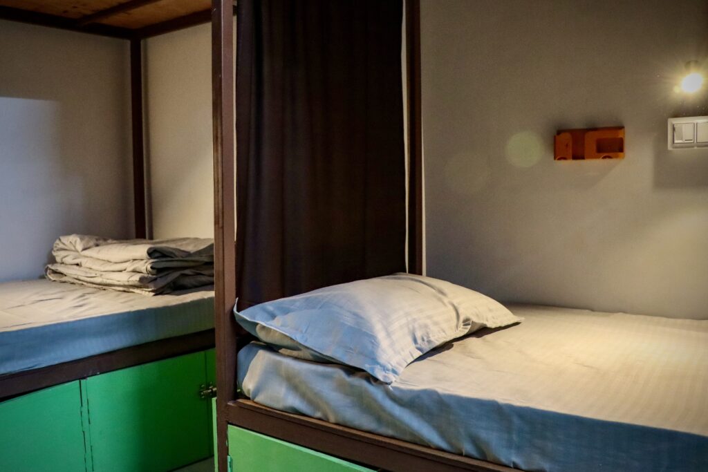 Bed in dorm room at Mosaic Hostel Varanasi Rooftop view at Mosaic Hostel Varanasi Female dorm beds Mosaic Hostel Lobby of Mosaic Hostel Varanasi Wi-Fi zone Mosaic Hostel